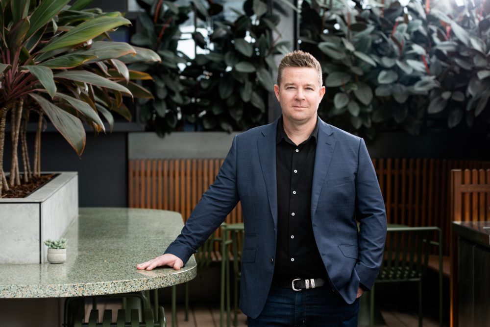 Business portrait Man in a suit in an outdoor environment. Natural light portrait and casual mood.